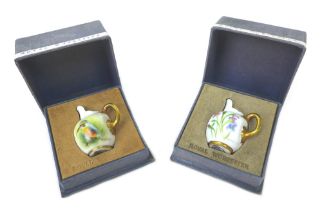 Two Royal Worcester miniature jugs, one painted with a kingfisher, signed G. Banks, the other