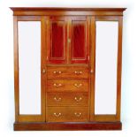 An Edwardian Maple & Co. mahogany compactum wardrobe, with dentil and inlaid decorated cornice,