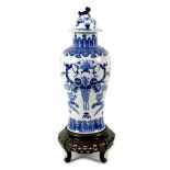 A Chinese porcelain vase, Qing Dynasty, 19th century, of baluster form, the domed cover with