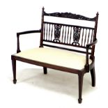 An Edwardian mahogany two seater settee