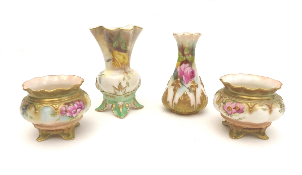 A group of four Royal Worcester pieces, comprising a pair of open salts, hand painted with roses, '