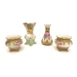 A group of four Royal Worcester pieces, comprising a pair of open salts, hand painted with roses, '