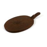 Robert 'Mouseman' Thompson of Kilburn (British, 1876-1955): an oak cheese board, with carved mouse
