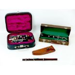 Three musical instruments, comprising a cased 'A. Santoni Pare' five piece clarinet, 67cm long, a