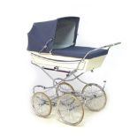 A vintage Marmet coach built pram, with blue hood/apron and attachable sun canopy, blue floral