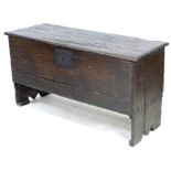 A 17th century oak sword chest, metal lock plate, plain front, 114.5 by 44 by 62 cm high.