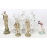 A group of ceramic figurines, a pair of Royal Worcester blush ivory, model 1206, modelled as a man