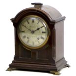 An Edwardian mantel clock, signed 'Searle Hoare & Co, London', silvered dial with Roman numerals,