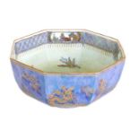 A Wedgwood pottery bowl, octagonal form, lustre glaze with dragons, birds, and buildings, pattern