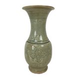 A 19th century Chinese celadon vase, of baluster form with incised decoration under a green