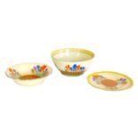 A group of three pieces of Clarice Cliff pottery, Bizarre 'Crocus' pattern, comprising a bowl, 22 by
