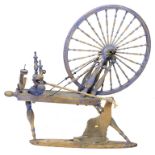 A 19th century spinning wheel, painted blue, a/f, 124 by 66 by 109 cm high.