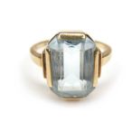 A 14ct gold Aquamarine style stone ring, the emerald cut stone 13 by 10mm, the band stamped 585, L/