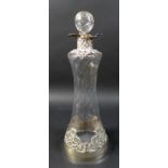 A Victorian decanter and stopper with silver applied scroll work, William Comyns & Sons, London