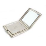 An Elizabeth II silver compact mirror, by Kigu of London, of square form with engraved decoration,