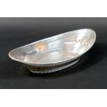 A silver dish, of boat form with pierced decoration, 23.5 by 12 by 5.5cm high, 6.5toz.