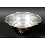 A silver bowl, with decorative rim, raised on three pierced feet, 19 by 8cm high, 4.98toz.