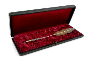 A Continental white metal pen, early 20th century, modelled as a feather quill with holder for a