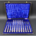 A cased set of six fish knives and six fish forks, Queens pattern, silver handles marked Yates