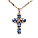 A pale blue sapphire and pearl inlaid cross shaped pendant, set with a single pearl 18mm diameter,