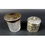 A pair of Victorian canisters, comprising a silver canister with ornate decoration, London 1901, and