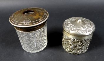A pair of Victorian canisters, comprising a silver canister with ornate decoration, London 1901, and