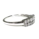 A 9ct white gold and diamond ring, set with two rows of brilliant cut diamonds, size N/O, 1.9g.