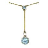 An Edwardian 15ct gold, aquamarine and diamond necklace, the drop pendant set with a round cut
