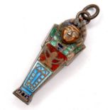 An Egyptian revival silver and enamel locket, in the form of a sarcophagus, with hinged top