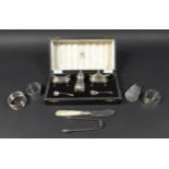 A group of silver items, comprising a three piece cruet set, Mappin & Webb, Birmingham 1957, with