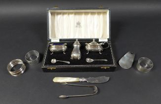 A group of silver items, comprising a three piece cruet set, Mappin & Webb, Birmingham 1957, with