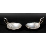 A pair of American Sterling silver dishes, early 20th century, the oval bowls cast with trailing