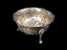 A Victorian silver bowl decorated with birds and animals with lion-topped legs, Wakely & Wheeler,