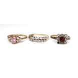 A group of three 9ct gold rings, the first set with a marquise cut pink stone with cubic zirconia to