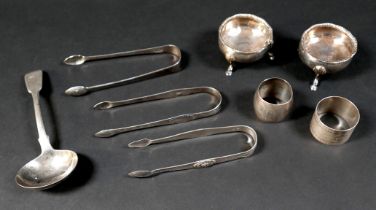 A group of Georgian and later silver items, comprising three pairs of sugar nips, two napkin
