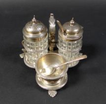 A Victorian cruet set, standing on three pad feet with scrolling handle, Henry Wilkinson & Co,