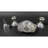 Three pieces of silver, comprising a pair of dwarf candle holders, marked W I Broadway & Co,