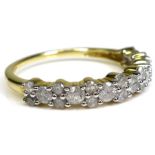 A 9ct gold and diamond half eternity ring, the brilliant cut stones of varying size set in a