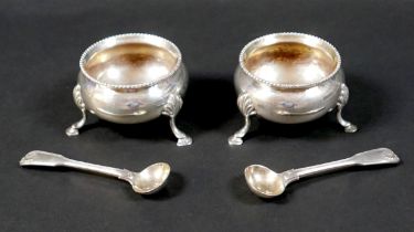 A pair of Victorian silver salts, of cauldron form with beaded rims, raised on three hoof feet, each