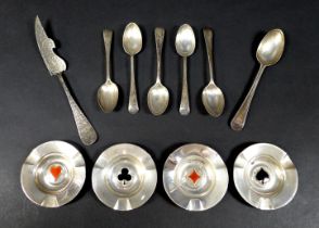 A small group of silver items, comprising four dishes with whist suits, 7.2cm