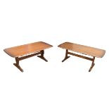 A pair of Ercol coffee tables, both with dark stained finish, each 129 by 68 by 52cm high. (2)