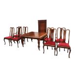 A Victorian mahogany dining table and eight Queen Anne style chairs, including two carvers