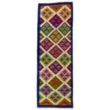 A Chobi Kilim runner, decorated with diamond pattern with six and a half diamonds through centre,