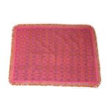 Two Spanish Casa Pupo rugs, with bright pink grounds, foliate decorated field, orange tasselled