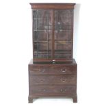 A George III mahogany bookcase, twin astragal glazed doors enclosing four adjustable shelves,