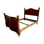 A Victorian mahogany double bed frame, serpentine foot board, and decorative spiral twist columns.