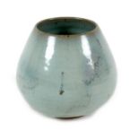 A Chinese pottery vase, decorated in an allover green glaze with asymmetric glaze line to lower rim,