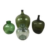 Four assorted glass carboys, including a 19th century example, 51cm high, and a large green glass