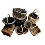 A large collection of wicker items, including three log baskets, largest 73 by 50cm high. (q)