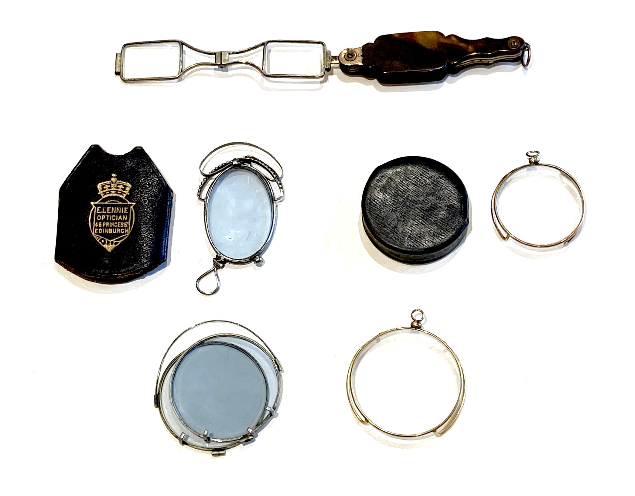 A group of five 19th century folding spectacles and monocles, one in case stamped 'E. Lennie,